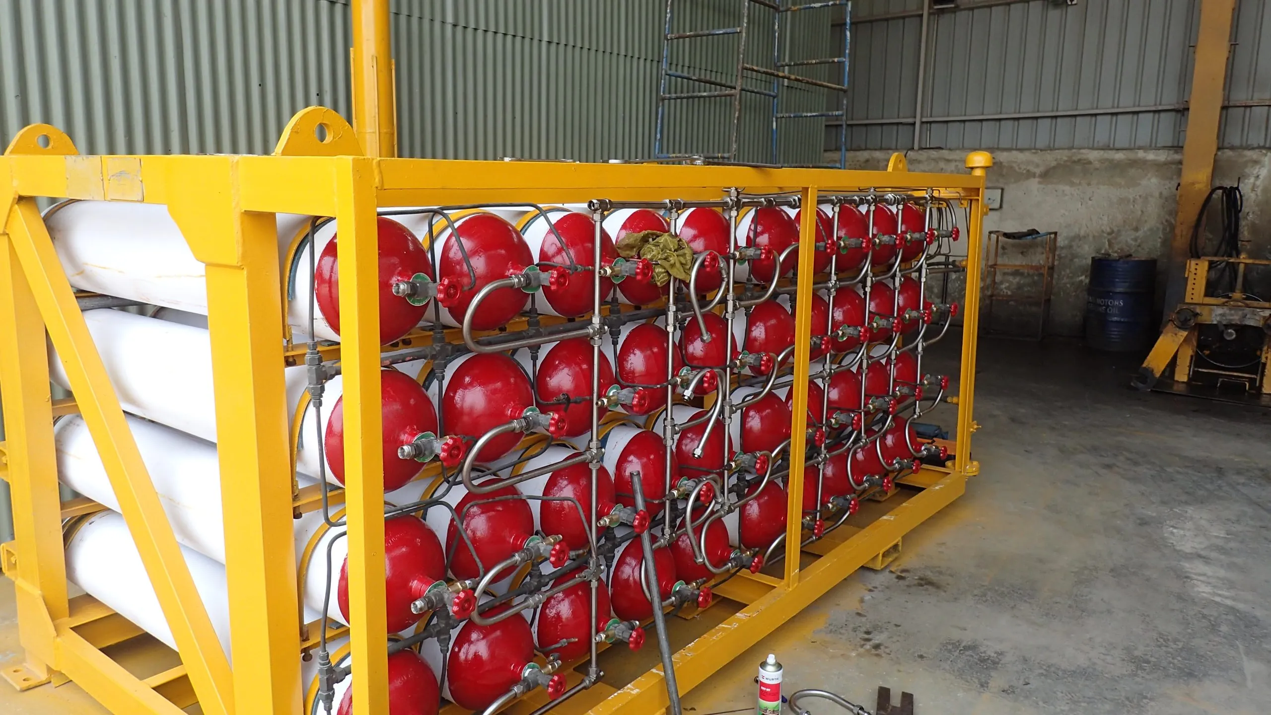 A CNG cascade of red cylinders in a yellow frame